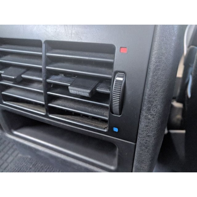 Rear seat air vent grille/slider tab — source image