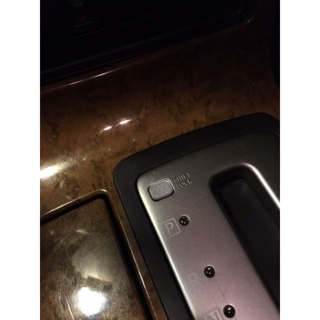 Shift Lock Plate Cover — source image