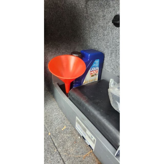 Trunk oil bottle and funnel holder — source image