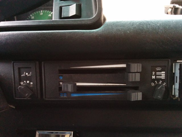 Fan and climate control knobs and levers — source image